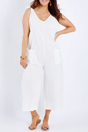 Model Laura wearing size 14 of the Summer Breeze Jumpsuit in colour White (White), from the front, cropped image