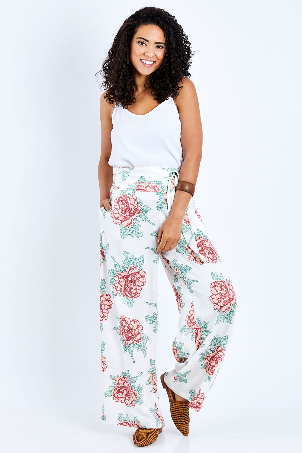 Model Pamela wearing size 10 of the Flowers For Me Pants in colour Whitefleur (White), from the front, showing the whole outfit