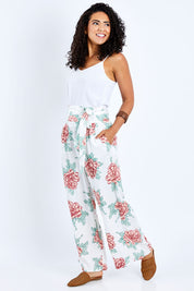 Model Pamela wearing size 10 of the Flowers For Me Pants in colour Whitefleur (White), from the front, showing the whole outfit
