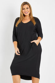 Model Fiona wearing size 16 of The Wanderer In Me Travel Dress in colour Black (Black), from the front, cropped image