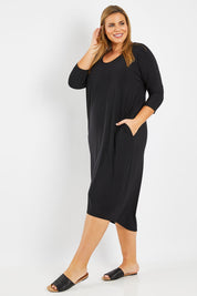 Model Fiona wearing size 16 of The Wanderer In Me Travel Dress in colour Black (Black), from the front, showing the whole outfit