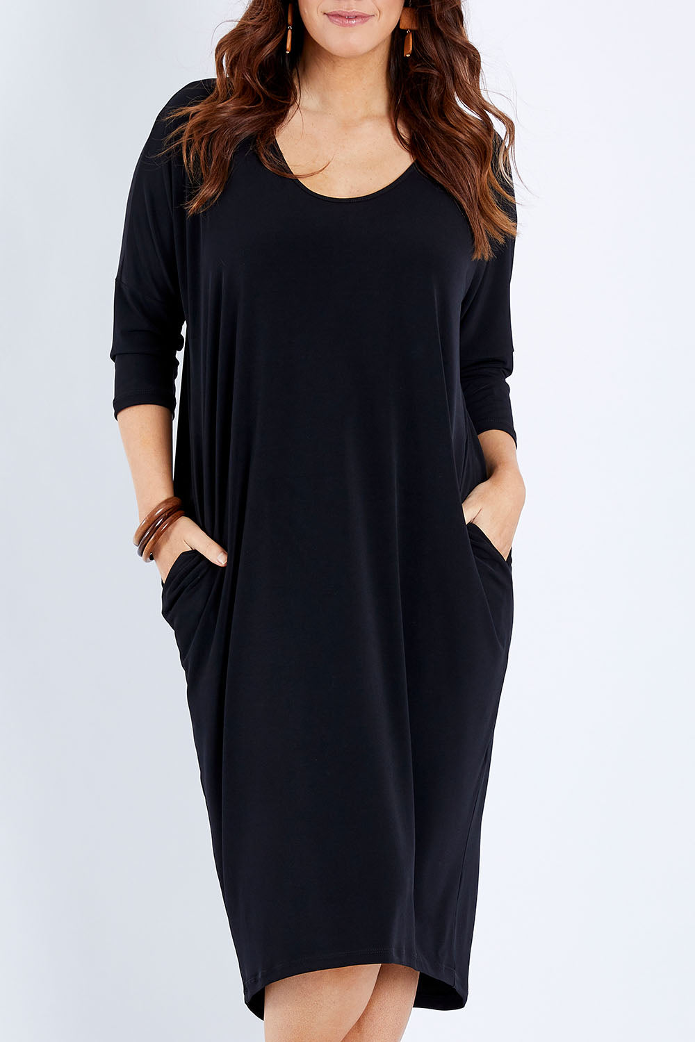 Model Laura wearing size 14 of The Wanderer In Me Travel Dress in colour Black (Black), from the front, cropped image