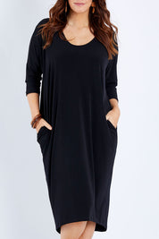 Model Laura wearing size 14 of The Wanderer In Me Travel Dress in colour Black (Black), from the front, cropped image