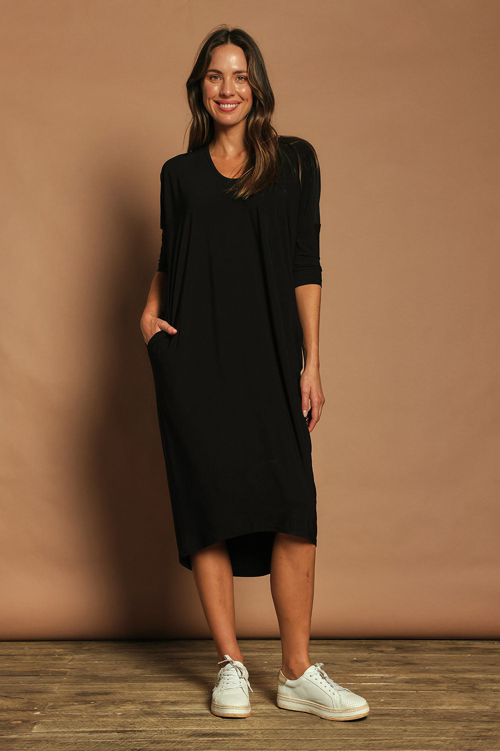 Model Madeline wearing size 10 of The Wanderer In Me Travel Dress in colour Black (Black), from the front, showing the whole outfit