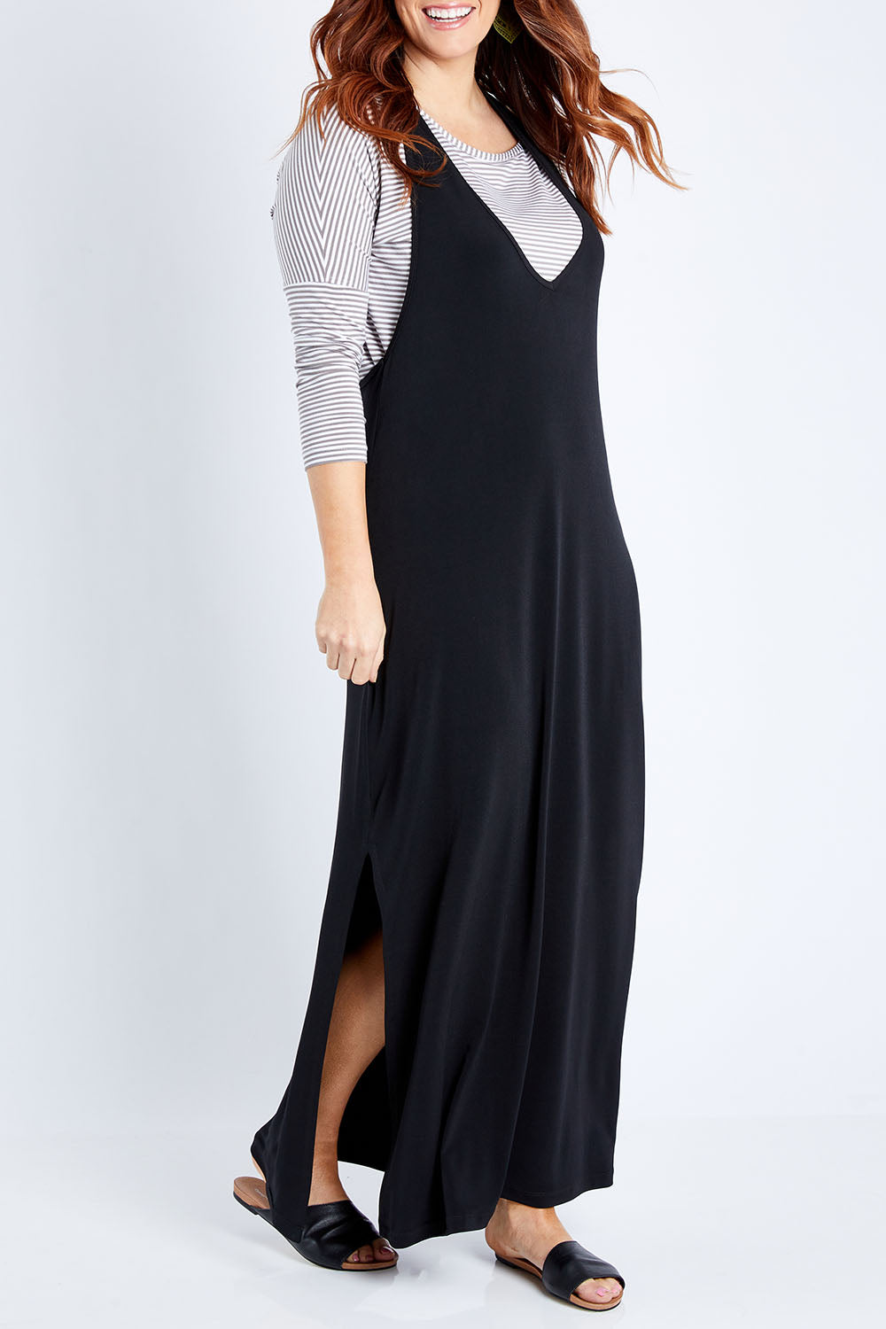 Model Laura wearing size 14 of The Wanderer In Me T Back Maxi in colour Black (Black), from the front, cropped image