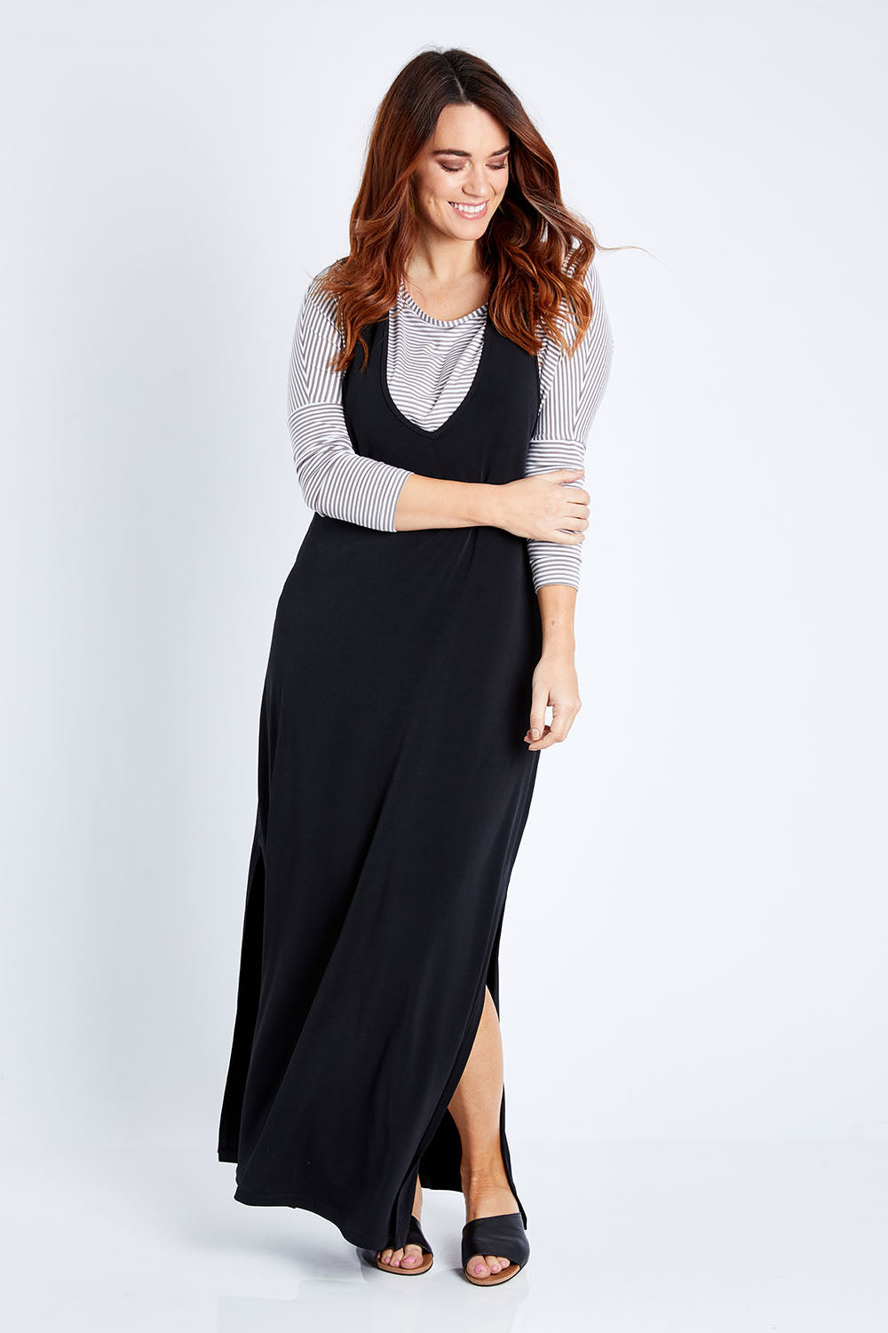 Model Laura wearing size 14 of The Wanderer In Me T Back Maxi in colour Black (Black), from the front, showing the whole outfit