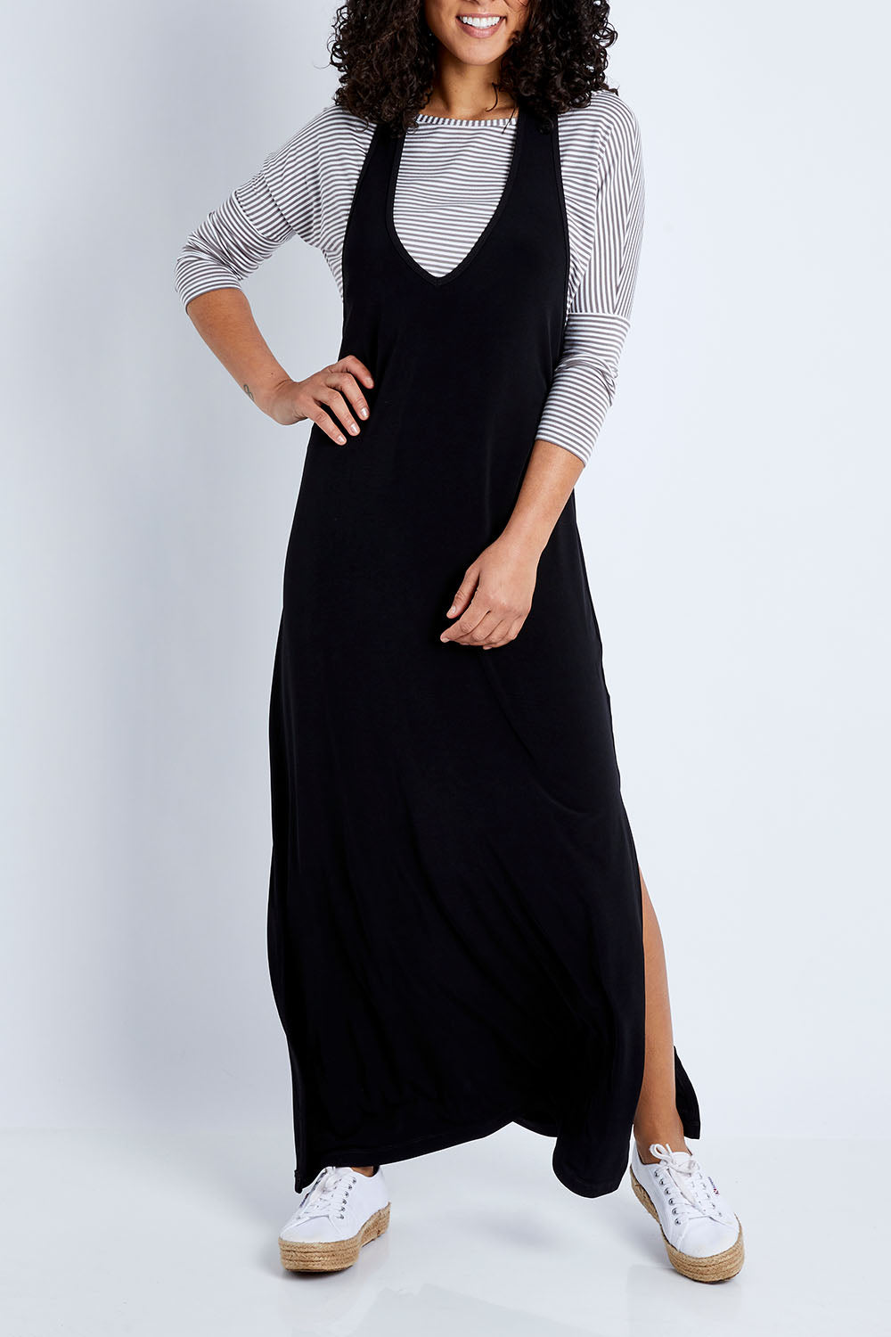Model Pamela wearing size 10 of The Wanderer In Me T Back Maxi in colour Black (Black), from the front, cropped image