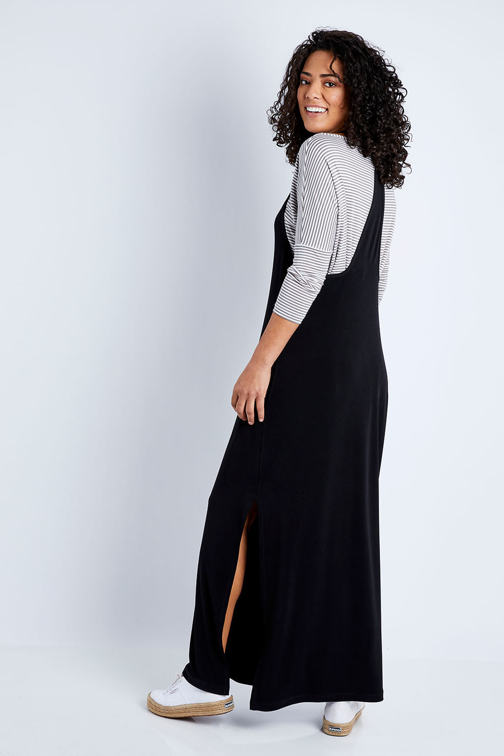 Model Pamela wearing size 10 of The Wanderer In Me T Back Maxi in colour Black (Black), from the front, showing the whole outfit