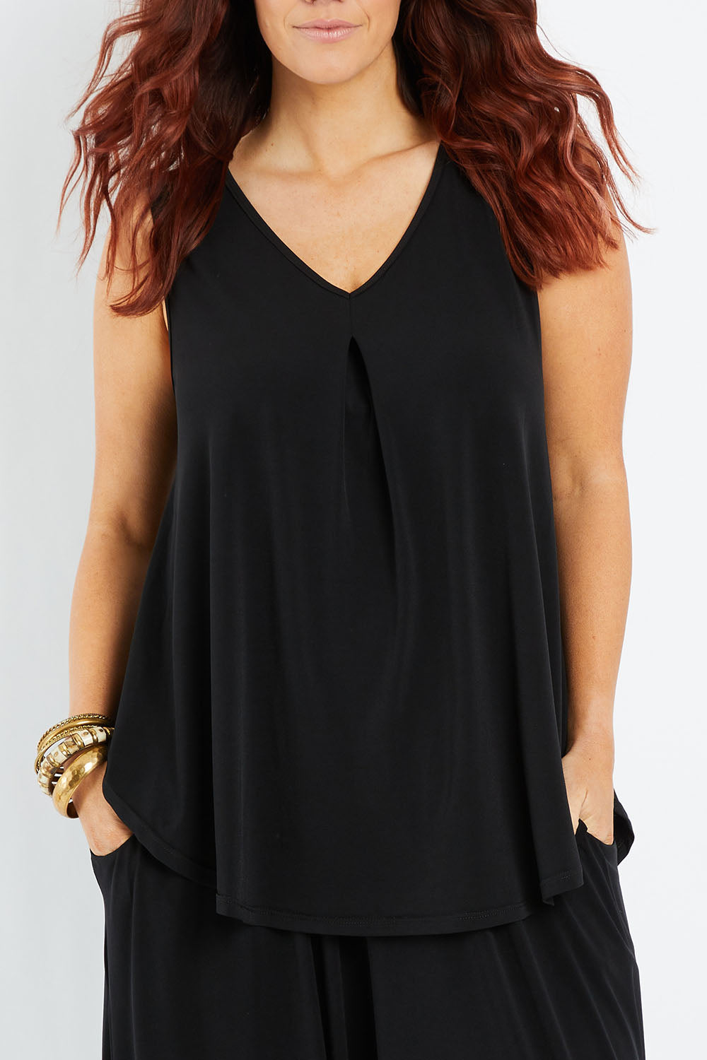 Model Laura wearing size 14 of The Wanderer In Me V Neck Travel Singlet in colour Black (Black), from the front, cropped image