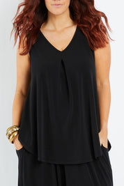 Model Laura wearing size 14 of The Wanderer In Me V Neck Travel Singlet in colour Black (Black), from the front, cropped image
