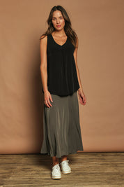 Model Madeline wearing size 10 of The Wanderer In Me V Neck Travel Singlet in colour Black (Black), from the front, showing the whole outfit