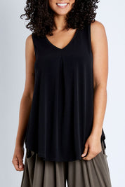 Model Pamela wearing size 10 of The Wanderer In Me V Neck Travel Singlet in colour Black (Black), from the front, cropped image