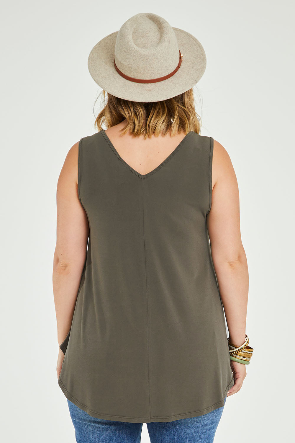Model Jess wearing size 14 of The Wanderer In Me V Neck Travel Singlet in colour Khaki (Green), from the back