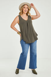 Model Jess wearing size 14 of The Wanderer In Me V Neck Travel Singlet in colour Khaki (Green), from the front, showing the whole outfit