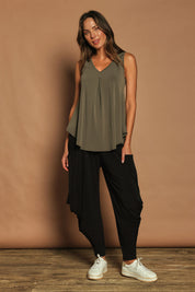 Model Madeline wearing size 10 of The Wanderer In Me V Neck Travel Singlet in colour Khaki (Green), from the front, showing the whole outfit