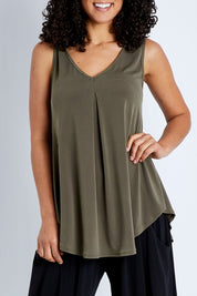 Model Pamela wearing size 10 of The Wanderer In Me V Neck Travel Singlet in colour Khaki (Green), from the front, cropped image