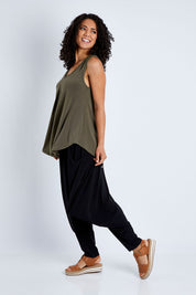 Model Pamela wearing size 10 of The Wanderer In Me V Neck Travel Singlet in colour Khaki (Green), from the front, showing the whole outfit
