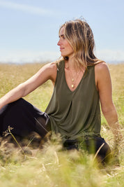 Model Tegan wearing size 10 of The Wanderer In Me V Neck Travel Singlet in colour Khaki (Green), from the front, showing the whole outfit