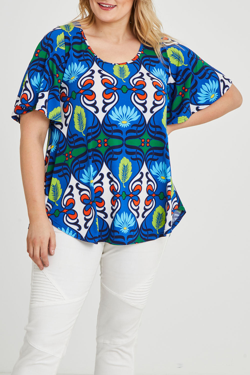 Model Keeara wearing size 16 of the Free Falling Top in colour Royal (Blue), from the front, cropped image