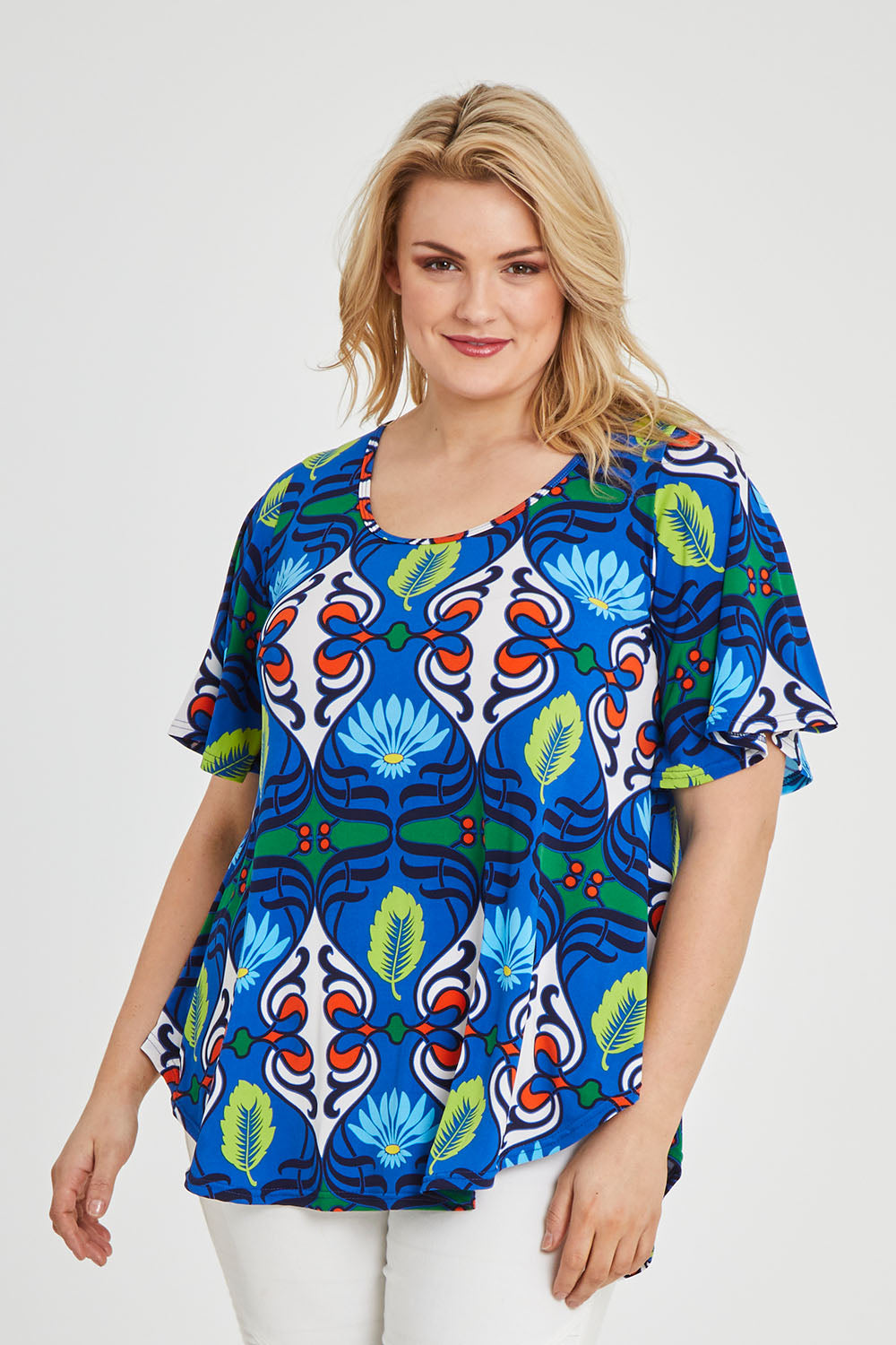 Model Keeara wearing size 16 of the Free Falling Top in colour Royal (Blue), from the front, cropped image