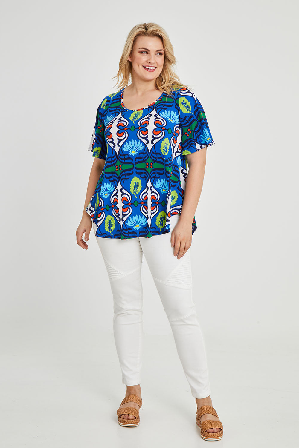 Model Keeara wearing size 16 of the Free Falling Top in colour Royal (Blue), from the front, showing the whole outfit