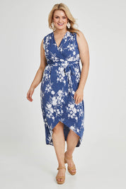 Model Keeara wearing size 16 of the Freedom Faux Wrap Dress in colour Denim (Blue), from the front, showing the whole outfit