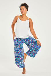 Model Noli wearing size 14 of the Good Vibes Balloon Hem Pants in colour Aztec (Blue), from the front, showing the whole outfit