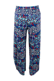 Product shot of the Good Vibes Balloon Hem Pants in colour Aztec (Blue), from the back
