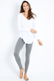 Model Amanda wearing size 10 of the Softly Swinging Bamboo Leggings in colour Fern (Green), from the front, showing the whole outfit