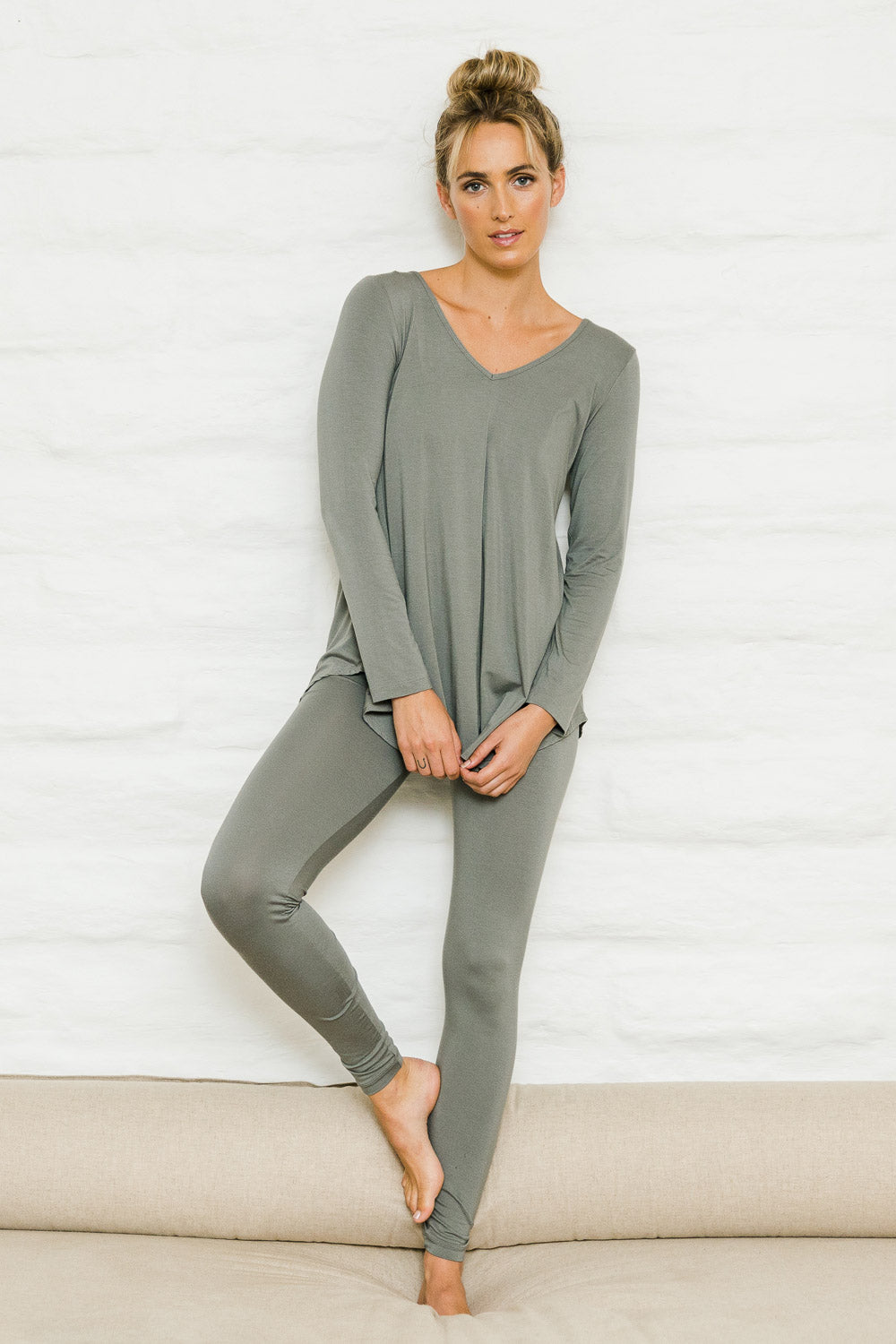 Model Tegan wearing size 10 of the Softly Swinging Bamboo Leggings in colour Fern (Green), from the front, showing the whole outfit