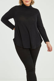 Model Fiona wearing size 16 of the Falling For You Skivvy Tunic in colour Black (Black), from the front, cropped image