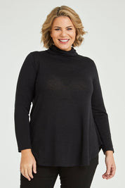 Model Fiona wearing size 16 of the Falling For You Skivvy Tunic in colour Black (Black), from the front, cropped image