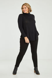 Model Fiona wearing size 16 of the Falling For You Skivvy Tunic in colour Black (Black), from the front, showing the whole outfit