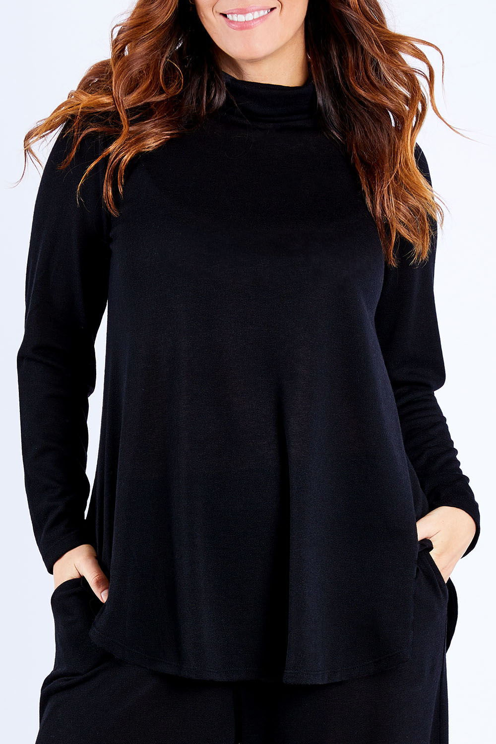 Model Laura wearing size 14 of the Falling For You Skivvy Tunic in colour Black (Black), from the front, cropped image