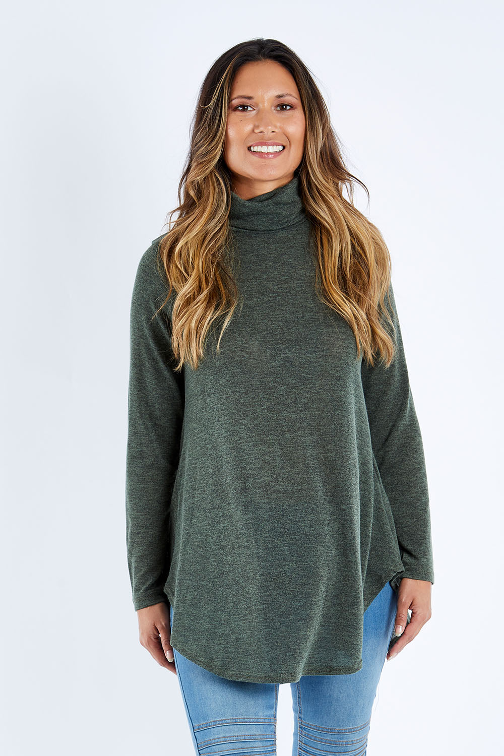 Model Kimberley wearing size 10 of the Falling For You Skivvy Tunic in colour Khaki (Green), from the front, cropped image