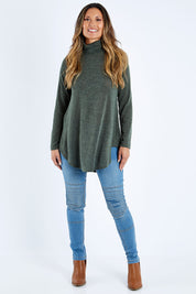 Model Kimberley wearing size 10 of the Falling For You Skivvy Tunic in colour Khaki (Green), from the front, showing the whole outfit