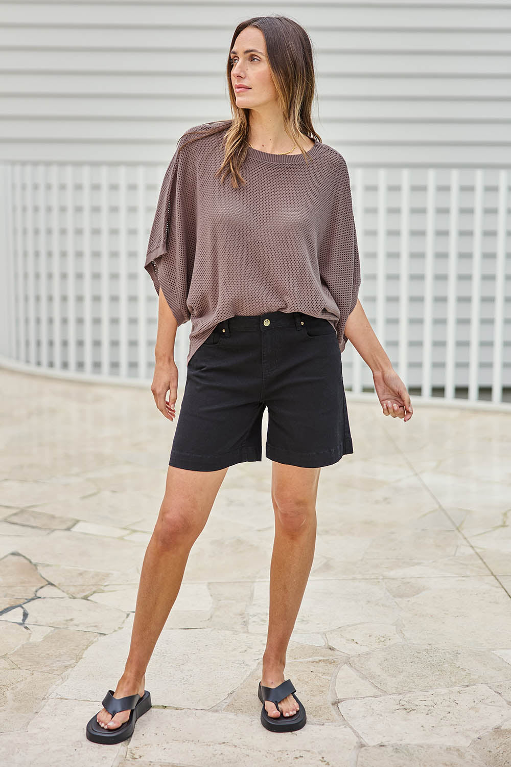 Model Tegand wearing size 10 of the Youre Always There For Me Plain Boyfriend Shorts – Black in colour Black, from the front