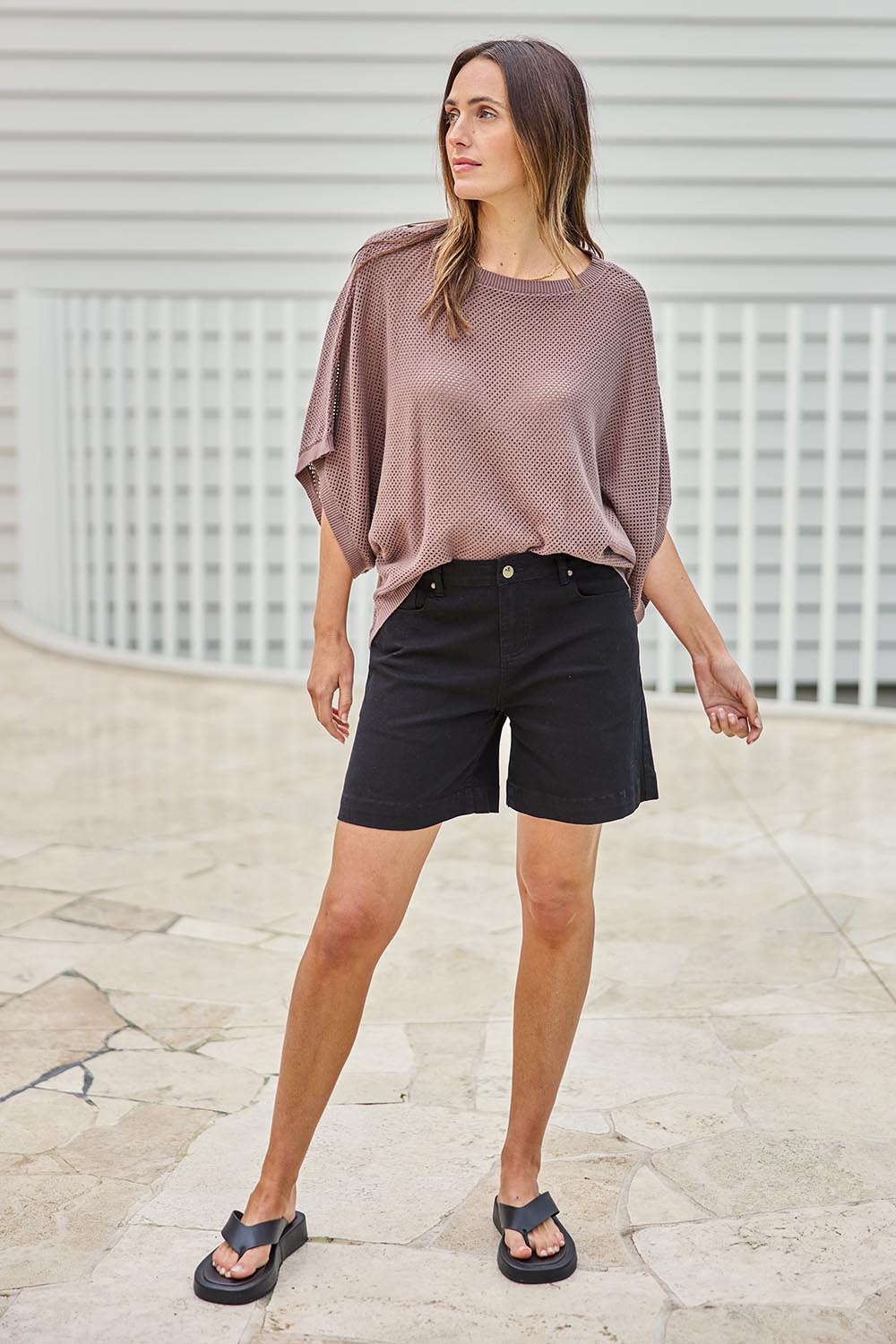 Model Tegand wearing size 10 of the Youre Always There For Me Plain Boyfriend Shorts – Black in colour Black, from the front