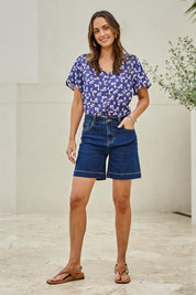 Model Tegand wearing size 10 of the Youre Always There For Me Plain Boyfriend Shorts – Darkdenim in colour Darkdenim, from the front
