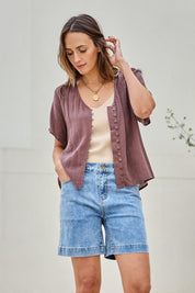 Model Tegand wearing size 10 of the Youre Always There For Me Plain Boyfriend Shorts – Denim in colour Denim, in a cropped view