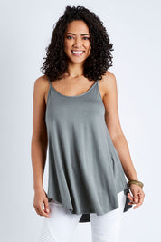 Model Pamela wearing size 10 of the Softly Swinging Bamboo Scoop Singlet in colour Fern (Green), from the front, cropped image