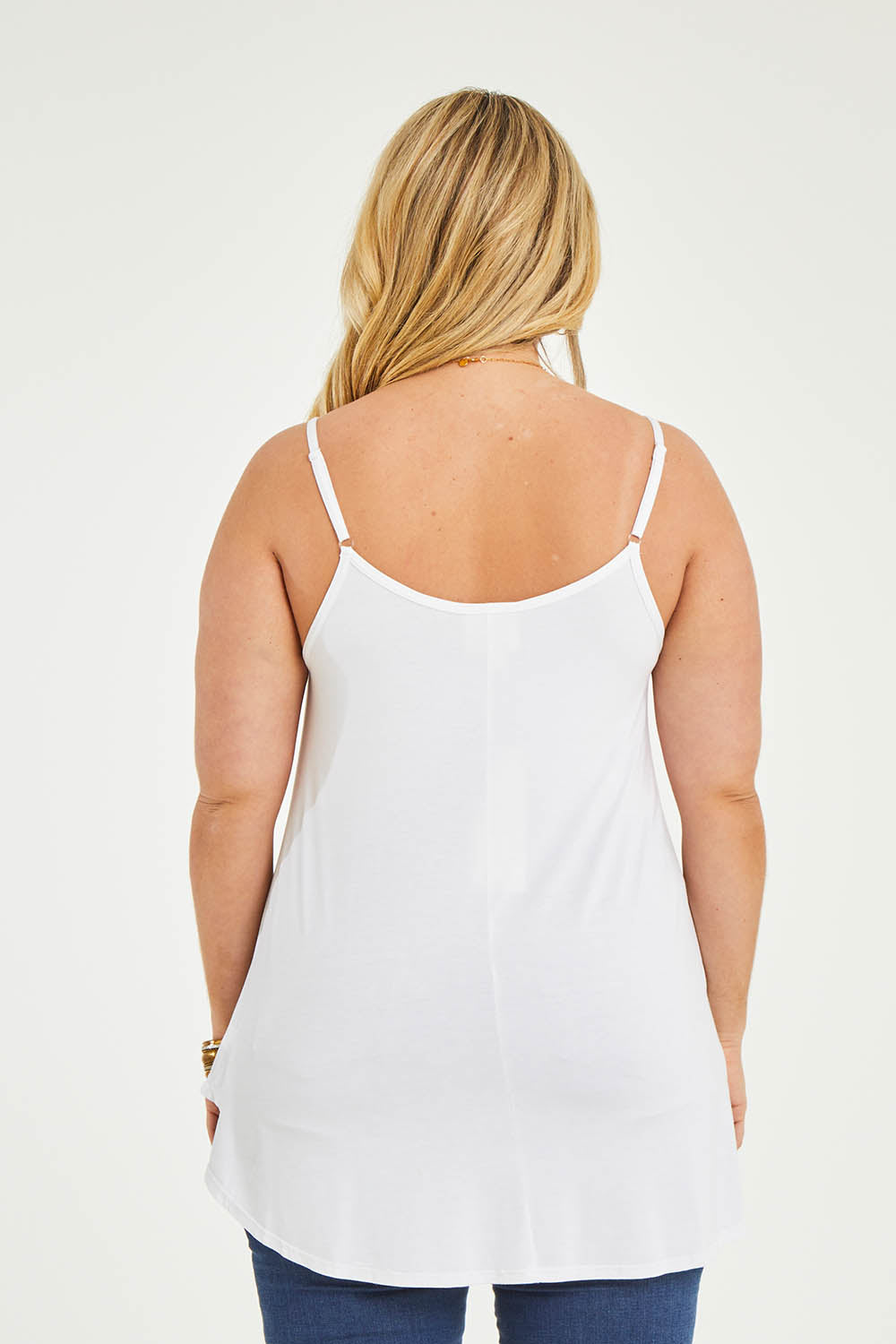 Model Katie wearing size 16 of the Softly Swinging Bamboo Scoop Singlet in colour White (White), from the back