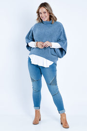 Model Jess wearing size L of the Addicted To You Sweater in colour Denim (Blue), from the front, showing the whole outfit