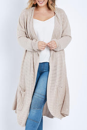 Model Jess wearing size L of the Starlit Night Cotton Cardi in colour Latte, from the front, cropped image
