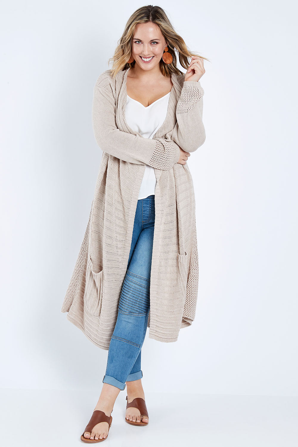 Model Jess wearing size L of the Starlit Night Cotton Cardi in colour Latte, from the front, showing the whole outfit