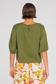 A model wearing the Ava Cotton Top in colour Khaki (Green), from the back