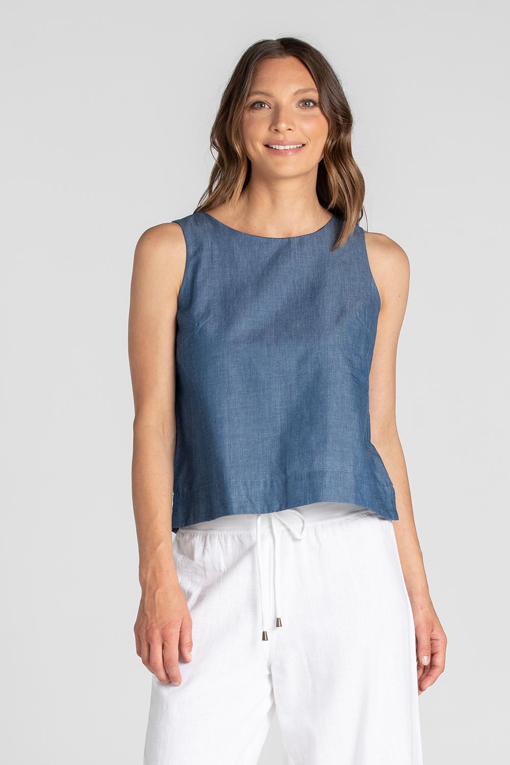 A model wearing the Hara Cotton Top in colour Chambray (Blue), from the front, cropped image