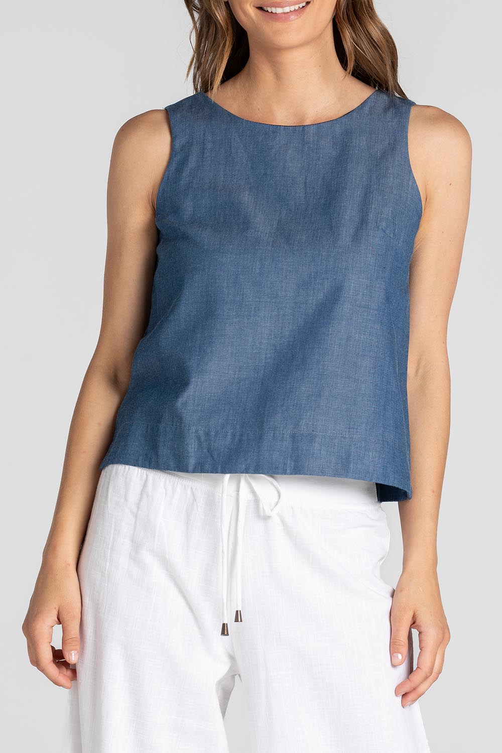 A model wearing the Hara Cotton Top in colour Chambray (Blue), from the front, cropped image