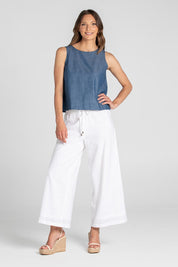 A model wearing the Hara Cotton Top in colour Chambray (Blue), from the front, showing the whole outfit