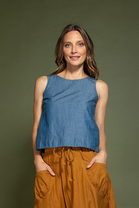 A model wearing the Hara Cotton Top in colour Chambray (Blue), from the front, showing the whole outfit